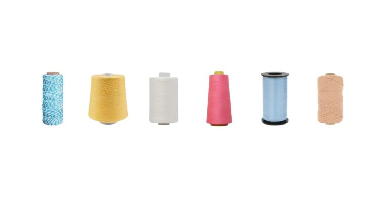 Yarn cones in multiple colours used for knitting custom pilates grip socks