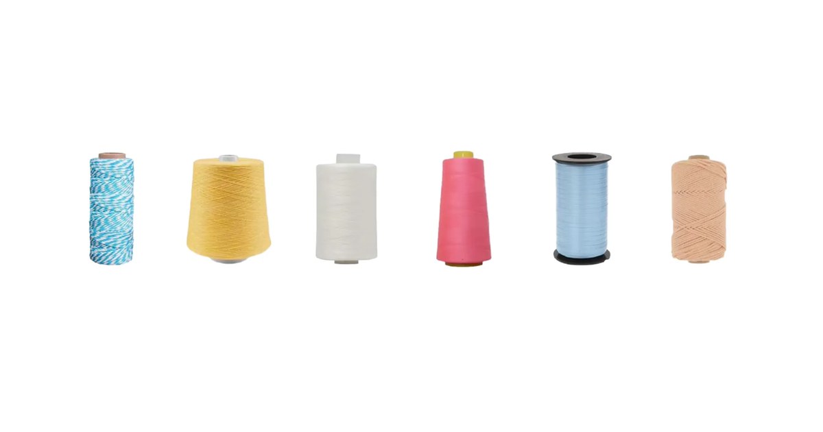 Yarn cones in multiple colours used for knitting custom pilates grip socks